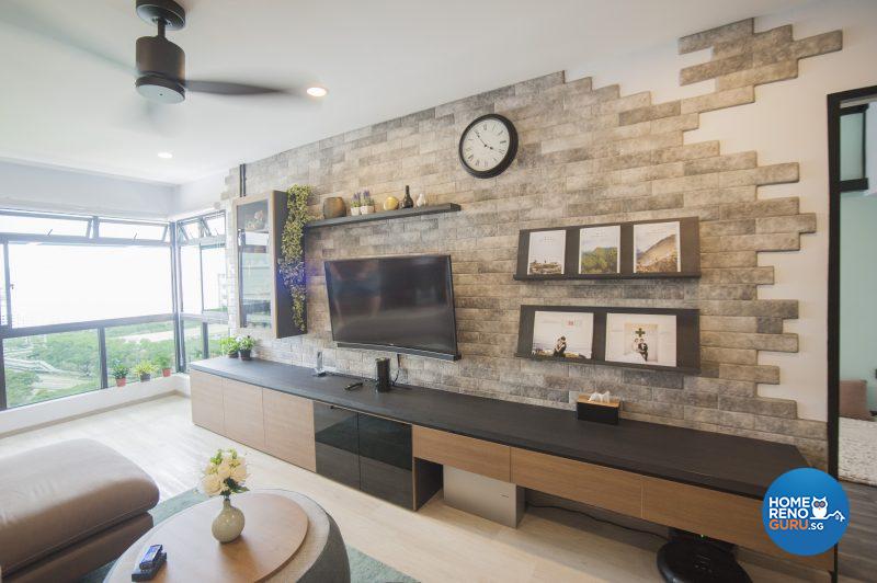 The living room is distinguished by an eye-catching feature wall with organic patterns of brickwork