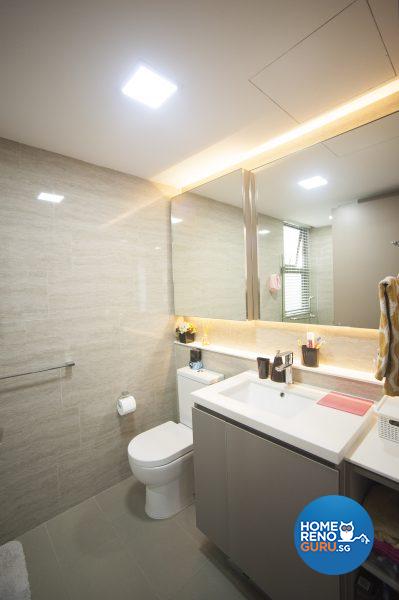 The hotel-like master bathroom is bathed in warm and white light