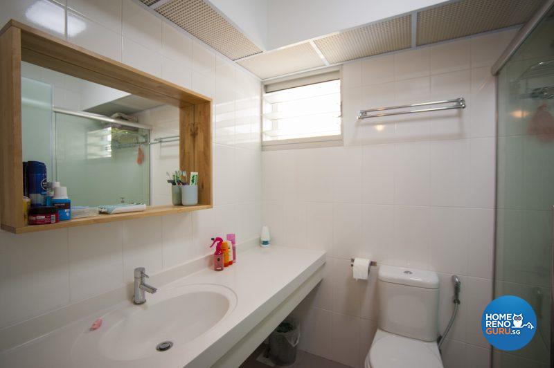 A clever wooden mirror frame doubles as a shelf in the master bathroom