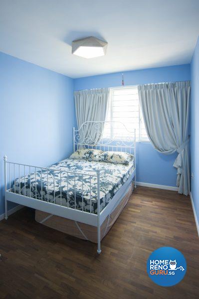 The sky-blue spare bedroom