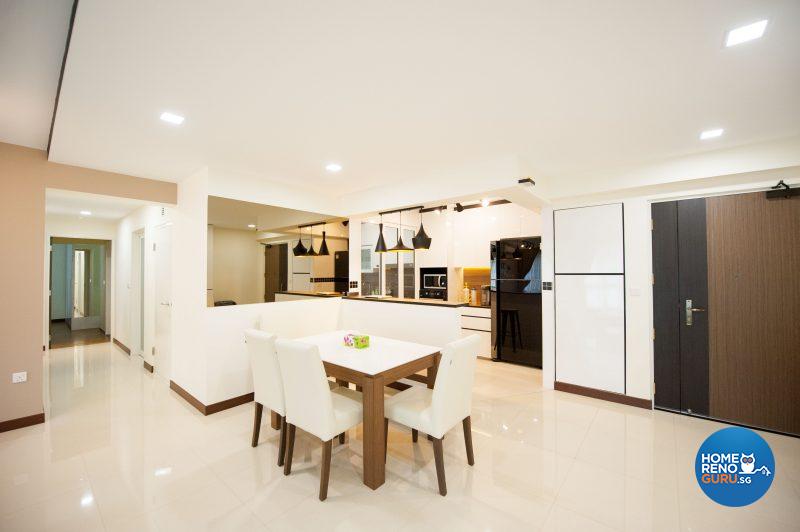 An open concept kitchen and dining area, semi-divided by a breakfast bar