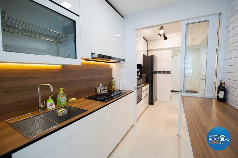 The sleek and elegant kitchen, with wood-lookalike countertops