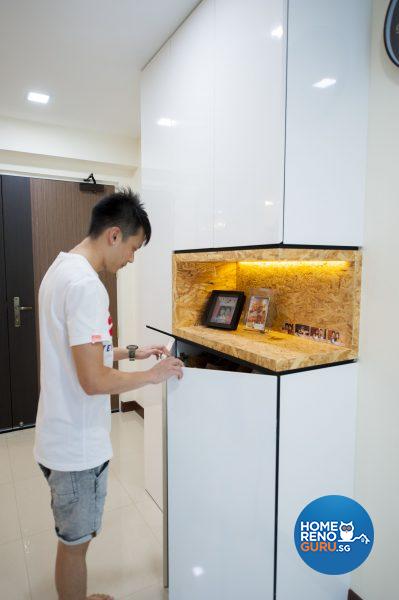 A spotlit display cabinet sits above the concealed shoe cabinet