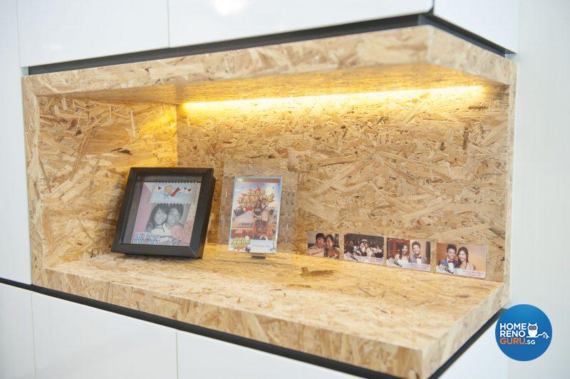 A spotlit display cabinet sits above the concealed shoe cabinet