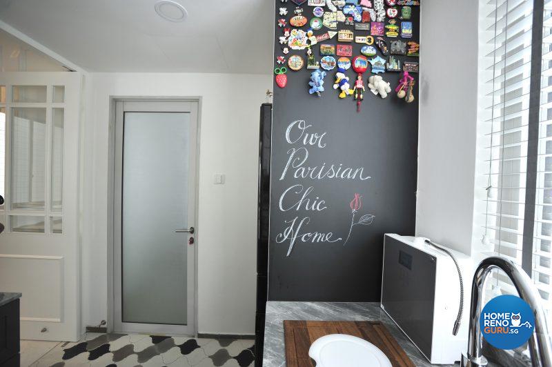 A handy chalkboard lines the side of the kitchen cabinet