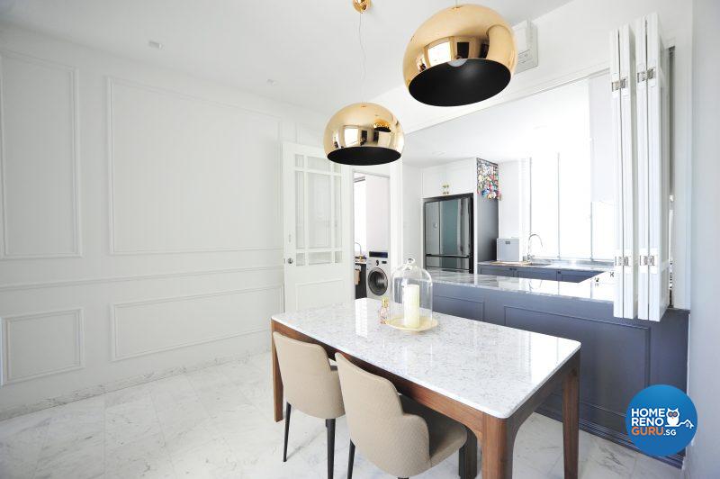 The dining area is defined by two statement-making Kartel lamps