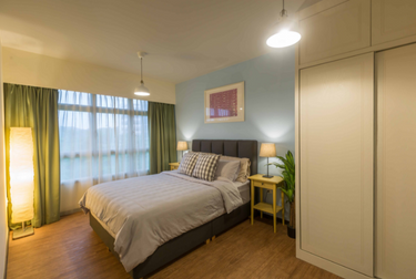 Bedroom with wardrobe, bed and house plants