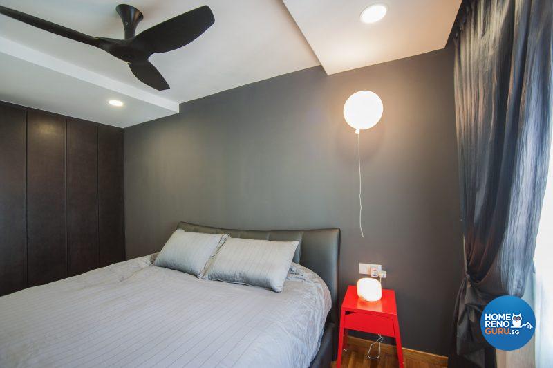 The master bedroom is distinguished by a whimsical suspended ‘balloon lamp’ and a red side table