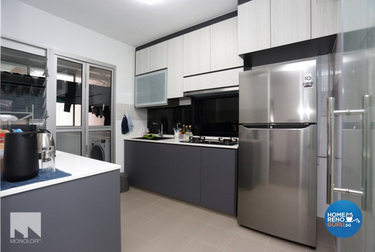 Kitchen with minimalist design and metal fridge