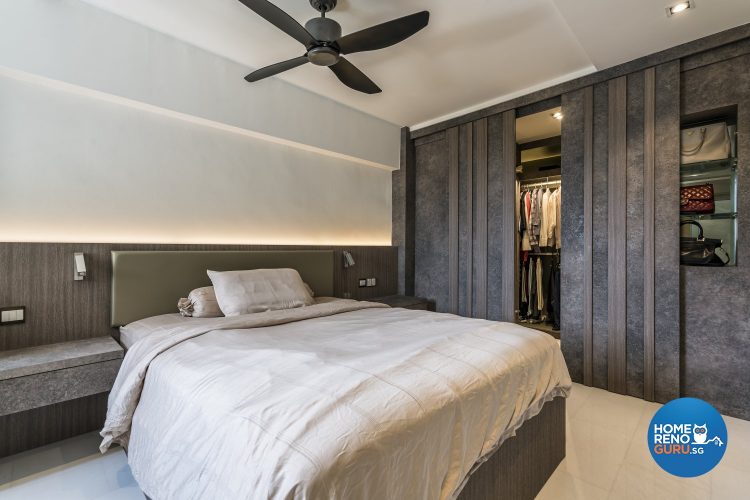 Greyish-brown wardrobe with vertical lines and queen-sized bed