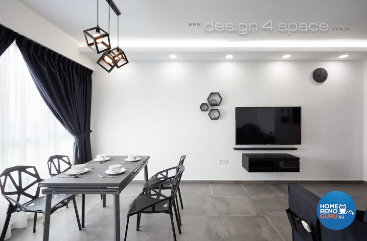 Spacious dining room with black table, chairs and tv and hanging square lights