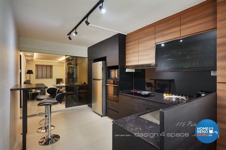 Kitchen with black countertop and brown shelf doors