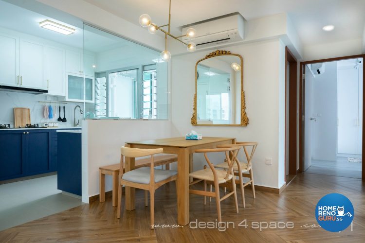 Dining room with brown tables and chairs, large mirror on wall and unique hanging lights