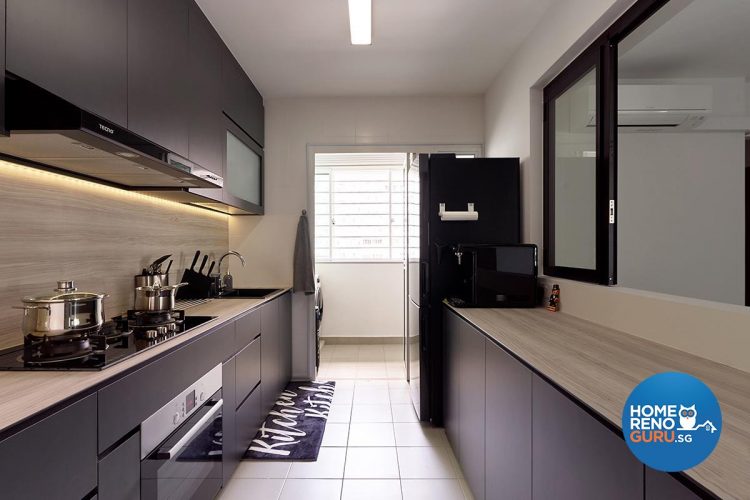 Kitchen with black shelves and wooden countertop and black fridge