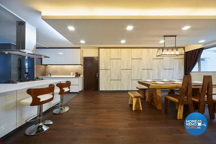 Spacious dining room with wooden tables and chairs and trapezium shaped frame for hanging lights