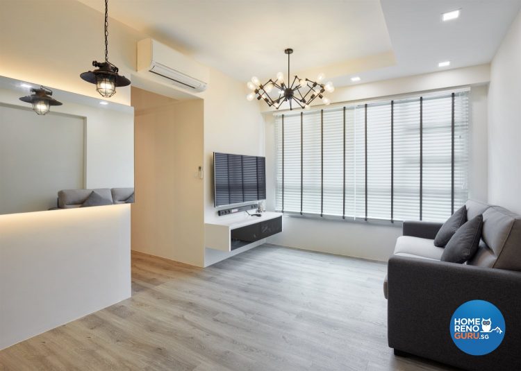 Spacious living room with unique hanging lights, brown sofa and wooden flooring