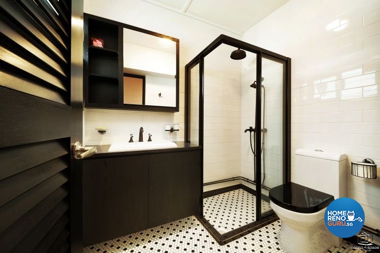 Tiled floors, black standing shower and black cupboards and white toilet bowl with black cover