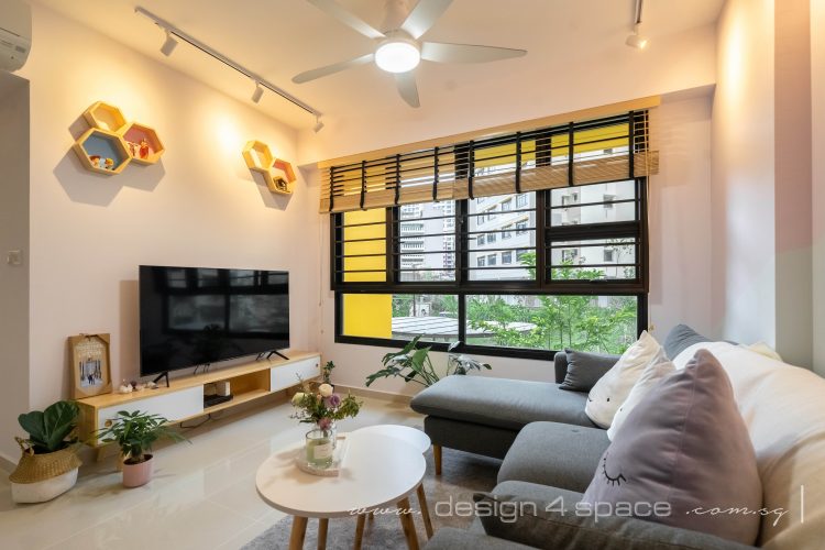 Living room with television, coffee table and L-shaped couch