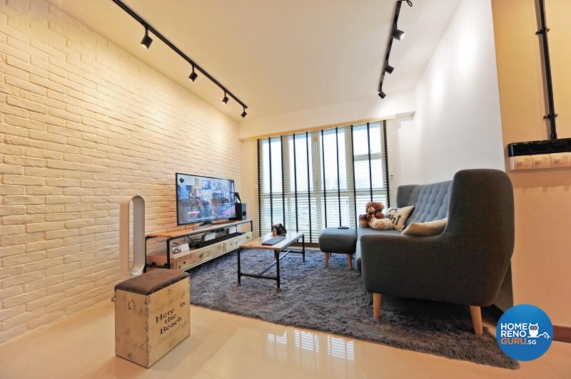 Track lighting and a floor rug add a warm and homely ambience to the living area