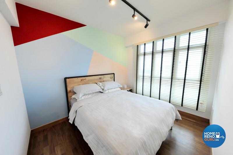 The colourful feature wall in the master bedroom is possibly the only departure from the industrial theme