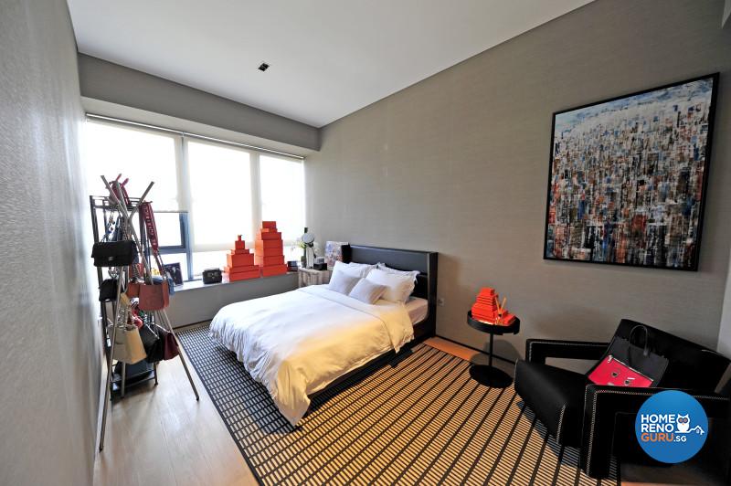 The hotel-like master bedroom is enlivened by bold artwork