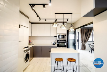 Kitchen with white furnishings and hanging lights