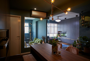 Dining area with dark wood table and dim lighting