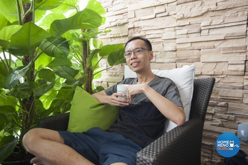 Happy homeowner Gabriel Seow on his beloved balcony