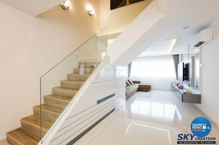 Stairs in the living room with wooden steps and glass railings