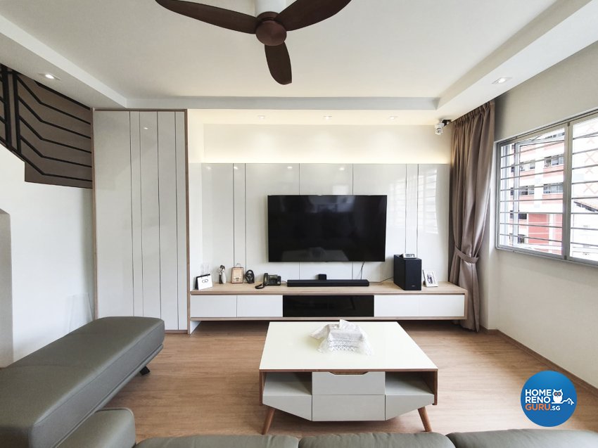 Living room with wooden floors and white walls