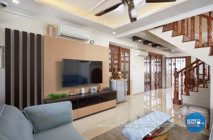 Living room with wooden feature wall and mounted television