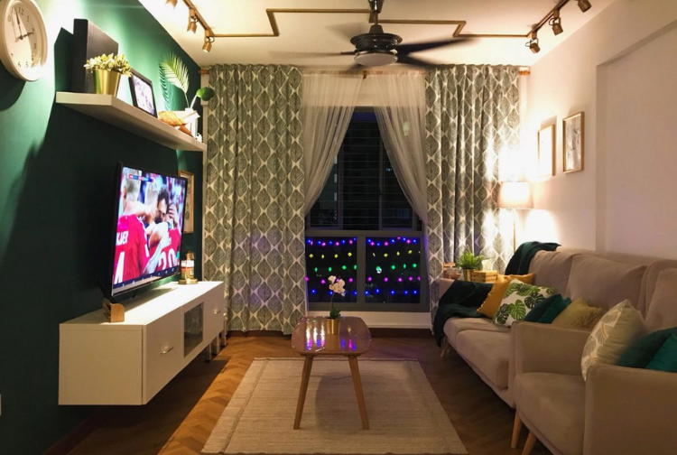 Living room in a HDB flat with wood flooring