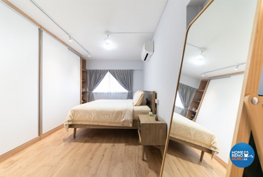 Bedroom with bed and wardrobe featuring wooden elements