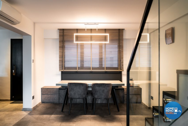 Stylish modern dining area with rectangular hanging light