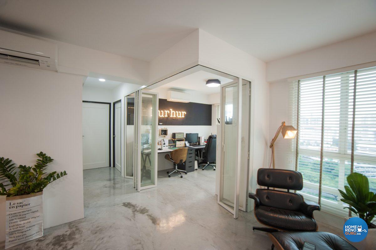 The office is separated from the living area with concertina-folding glass doors