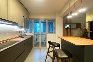 Kitchen with bar counter and high chairs