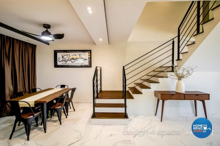 Dining room with stairs and dark brown furniture