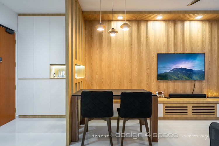 Dining area with wooden partition and Muji-inspired feature wall