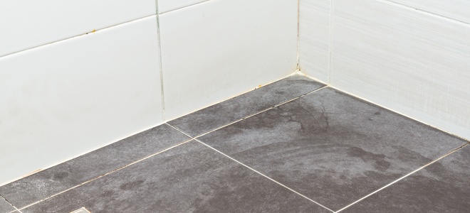 Soap and water spots on dark bathroom tiles