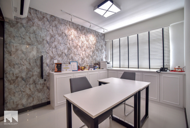 Study room with grey elegant wallpaper and L-shaped desk