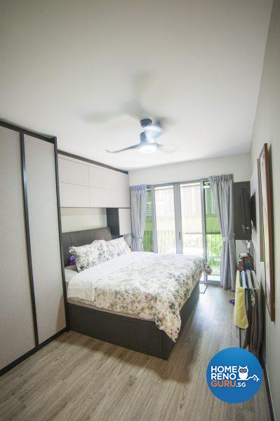 The master bedroom features floor-to-ceiling built-in closets and wood-lookalike flooring