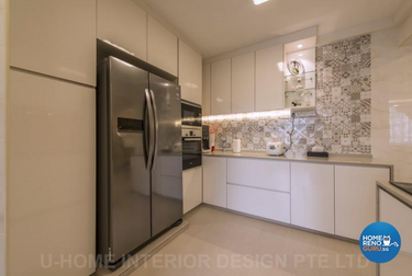 Kitchen with white cupboards and peranakan backsplash tiles