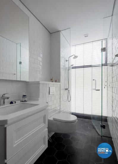 White-themed bathroom with a wall-mounted toilet bowl
