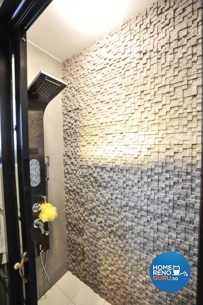 The sleek shower cubicle has a textured tiled wall