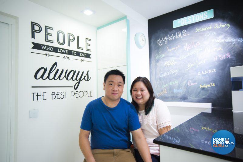 Desmond and Tiffany in front of their evolving work of art – the chalkboard adorned with guests’ messages