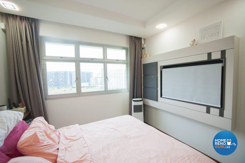 An automated blind conceals the TV in the bedroom for feng shui purposes