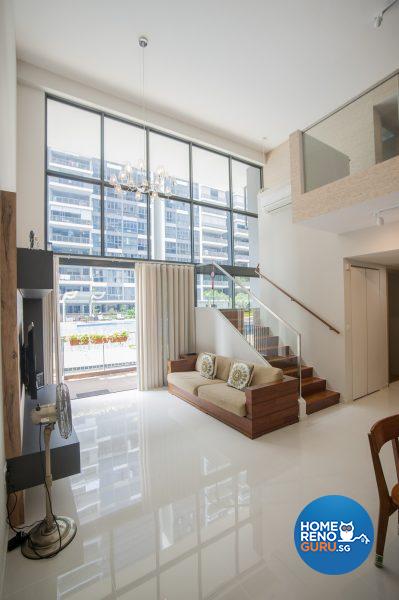 The high ceiling in the light-filled living area extends to the second level