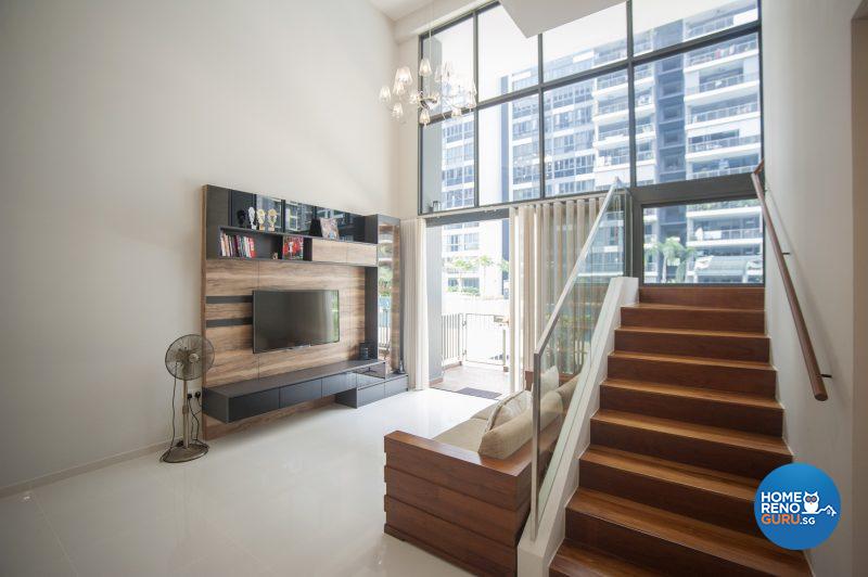 The high ceiling in the light-filled living area extends to the second level