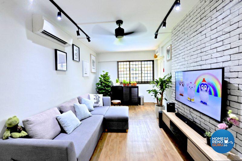 Furniture is placed against the walls to optimise the long, linear living space